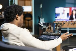 Teleworker speaks in remote teleconference telework call